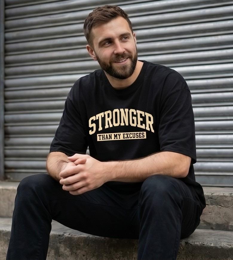 Black t-shirt with "Stronger Than My Excuses" text