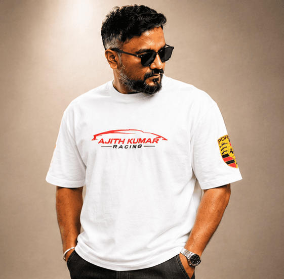 White Ajith Kumar Racing t-shirt, black pants, sunglasses