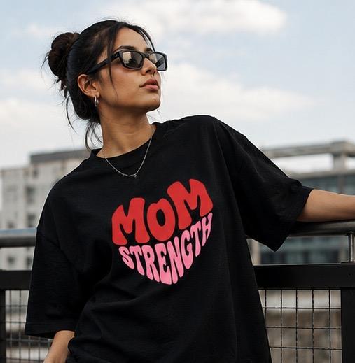 Black oversized t-shirt with Mom Strength heart graphic