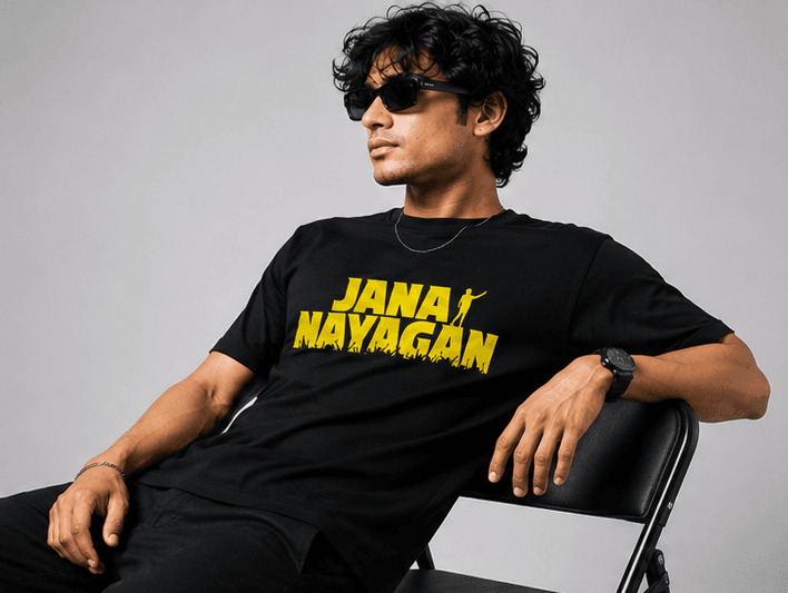 Black t-shirt with yellow "JANA NAYAGAN" text and graphic