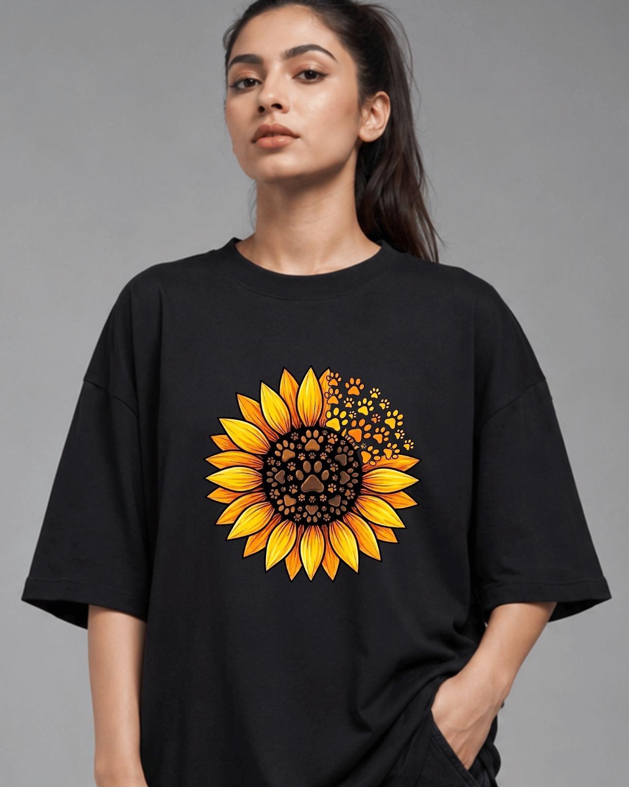 Black oversized t-shirt with sunflower and paw print graphic